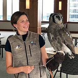 Heather Meuleman with an ambassador Verreaux's Eagle-owl on her gloved hand.