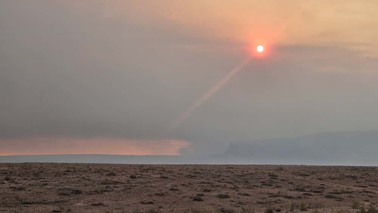 The distant Vermilion Cliffs shrouded in smoke from the White Sage Fire.