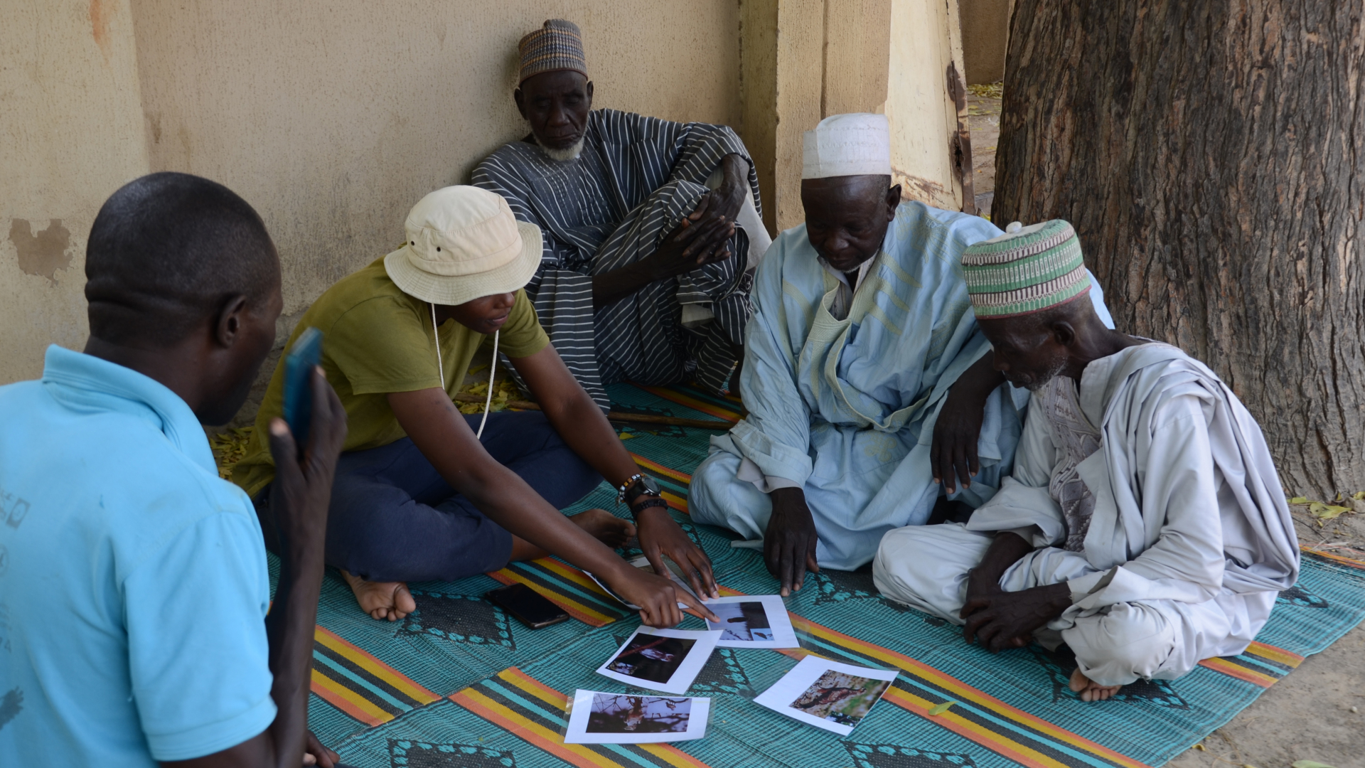 A recipient of the African Raptor Leadership Grant speaking to community members during her graduate work.