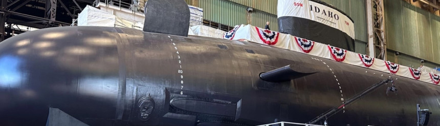 Spectators gather to observe a christening of the pre-commissioning unit (PCU) Idaho (SSN 799) during a ceremony at General Dynamics Electric Boat shipyard facility in Groton, Conn., March 16, 2024.
