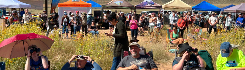 Visitors wait for the condors to depart with pop-up tents and other displays in the background at the in-person event for our 2026 California Condor Release.