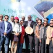 Dr. Lily-Arison René de Roland posing with attendees at the ceremony where he was awarded the "Commander" distinction by the Malagasy government.