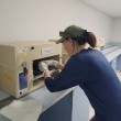 TPF Propagation Program Manager Chelsea Haitz placing an egg into an incubator.