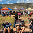 Visitors wait for the condors to depart with pop-up tents and other displays in the background at the in-person event for our 2026 California Condor Release.