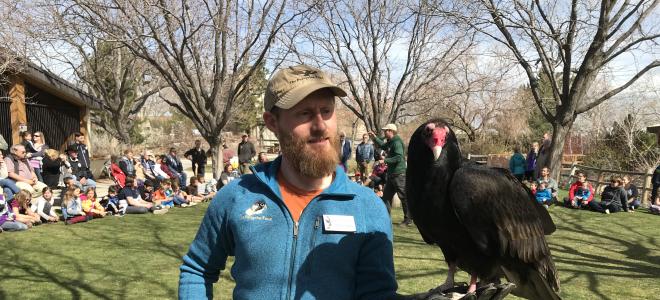Education Coordinator Curtis Evans holds Lucy the Turkey Vulture