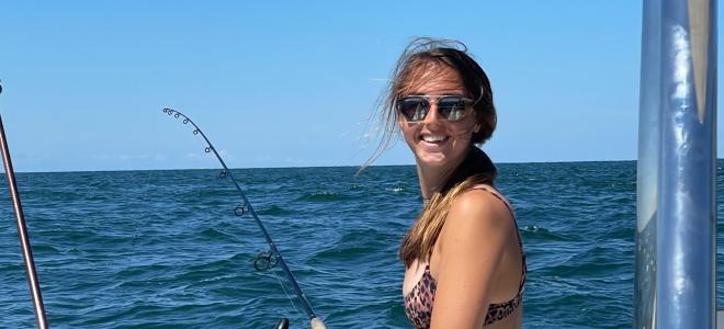 Nonie Thomas fishing from a boat at sea