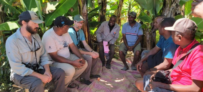 Peregrine Fund staff members speaking with Malagasy community leaders.