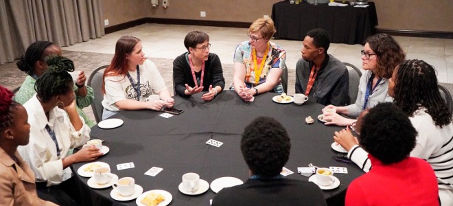 A Madagascar team member at a roundtable discussion at a conference with other raptor experts and biologists.