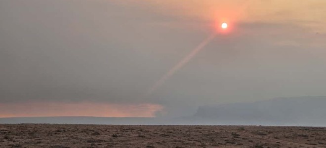 The distant Vermilion Cliffs shrouded in smoke from the White Sage Fire.