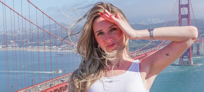 Casey Rosen standing in front of the Golden Gate Bridge.