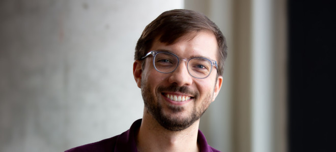 A closeup photo of Will Seaton smiling.