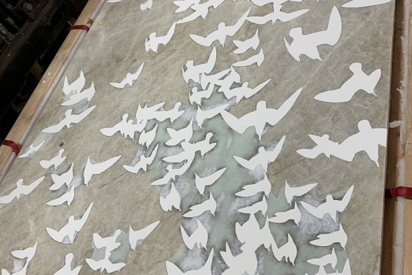 A finished quartzite and epoxy shorebird panel ready for installation.