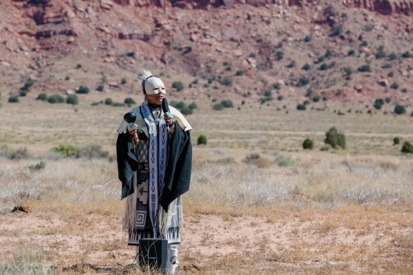 A member of the Havasupai Tribe conducts a blessing ceremony at the in-person event.