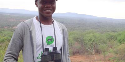 Student Sydney Shema with binoculars