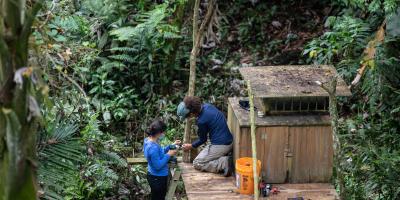 Two biologists prepare release site