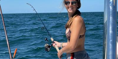 Nonie Thomas fishing from a boat at sea