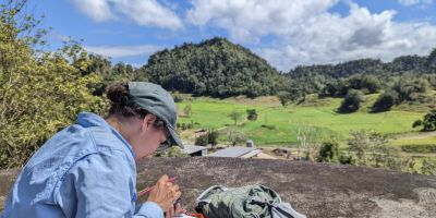 Field biologist taking notes in the field