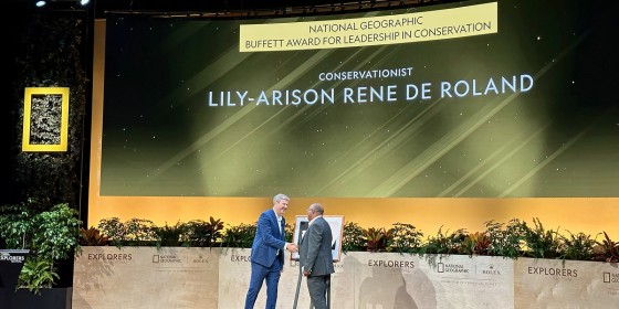 Dr. Lily-Arison Rene de Roland on stage receiving the National Geographic Buffett Award.