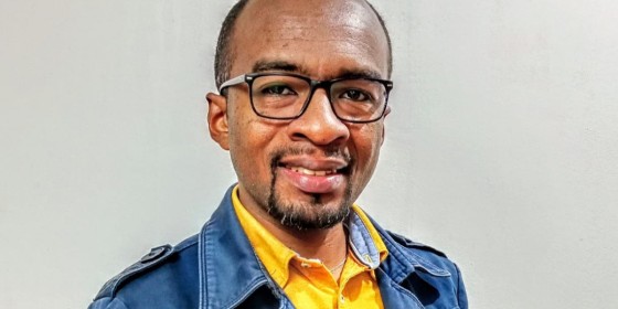 A headshot of Jean Marius Rakotondramanga in front of a light gray background.