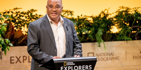 Lily-Arison Rene de Roland speaking at a podium.