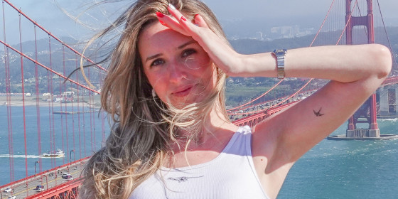 Casey Rosen posing in front of the Golden Gate Bridge.