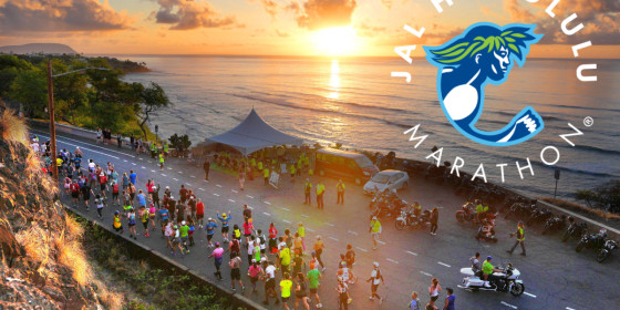 The logo of the JAL Honolulu Marathon superimposed on an image of runners along a shoreline road as the sun sets over the ocean behind them.