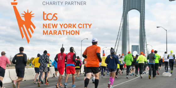 The logo of the TCS NYC Marathon superimposed on an image of runners on the Verrezzano–Narrows Bridge at the start of the race.