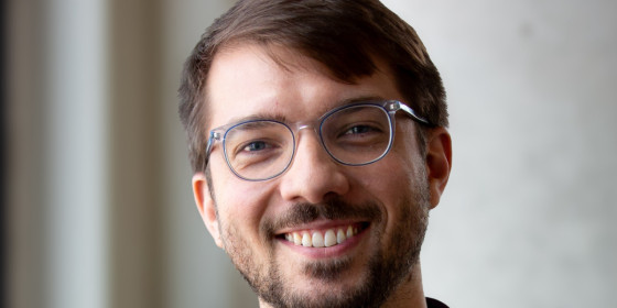 A closeup photo of Will Seaton smiling.