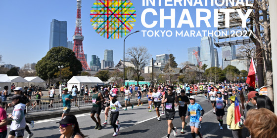 Runners in the Tokyo Marathon with the Tokyo Tower in the background.